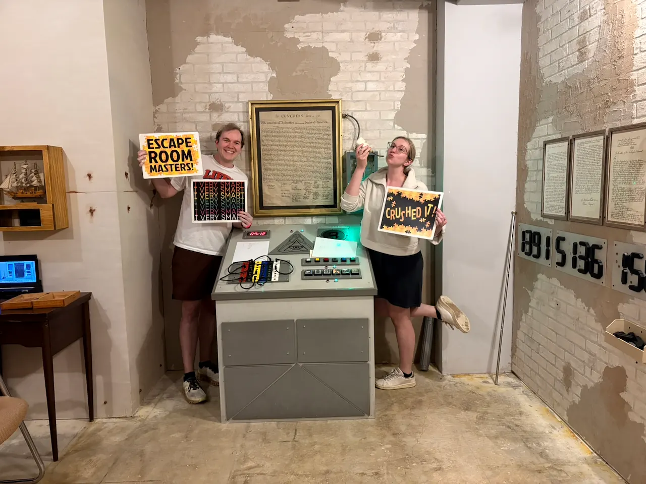 Jay and Gabi celebrating after completing the National Treasure themed escape room.